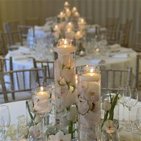 fwthumbEvent flowers Coworth Park orchids submerged with floating candles.jpg
